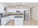 Modern kitchen with island, stainless steel appliances, and granite countertops at 3740 W Denton Ln, Phoenix, AZ 85019