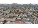 Aerial view showcasing a residential neighborhood with numerous homes, pools, and mountain views at 3815 E Cortez St, Phoenix, AZ 85028