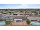 Aerial view of a single-Gathering home with a pool and solar panels, situated in a residential neighborhood at 3815 E Cortez St, Phoenix, AZ 85028