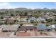 Aerial perspective of houses with pools, showcasing a neighborhood with mountain backdrop at 3815 E Cortez St, Phoenix, AZ 85028