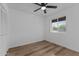 Well-lit bedroom featuring wood-look floors and ample closet space at 3815 E Cortez St, Phoenix, AZ 85028