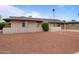 Brick house with a red gravel front yard, and stepping stones leading to the entrance at 3815 E Cortez St, Phoenix, AZ 85028