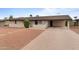 Tan brick house with a brick paver driveway and a small, landscaped front yard at 3815 E Cortez St, Phoenix, AZ 85028