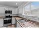 Modern kitchen with white cabinets, stainless steel appliances, and subway tile backsplash at 3815 E Cortez St, Phoenix, AZ 85028