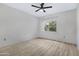 Bright bedroom with ceiling fan and wood-look flooring at 3830 E Lakewood E Pkwy # 2047, Phoenix, AZ 85048