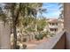 Ground level courtyard view with landscaping and building access at 3830 E Lakewood E Pkwy # 2047, Phoenix, AZ 85048