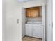 Laundry room with washer, dryer, and upper cabinets at 3830 E Lakewood E Pkwy # 2047, Phoenix, AZ 85048