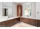 Elegant bathroom with double vanity, modern cabinetry, and mosaic tile accents at 39349 N 107Th Way, Scottsdale, AZ 85262