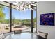 Modern dining area showcasing a hot tub and backyard views at 39349 N 107Th Way, Scottsdale, AZ 85262