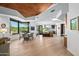 Open concept dining area with hardwood floors and a modern chandelier at 39349 N 107Th Way, Scottsdale, AZ 85262