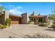 Contemporary home with a large driveway and desert landscaping at 39349 N 107Th Way, Scottsdale, AZ 85262