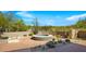 Relaxing hot tub with desert landscaping and fire pit at 39349 N 107Th Way, Scottsdale, AZ 85262