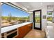 Kitchen features a breakfast bar and stunning backyard views at 39349 N 107Th Way, Scottsdale, AZ 85262