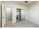 Bedroom with mirrored closet doors and neutral carpeting at 42593 W Falling Star Ct, Maricopa, AZ 85138