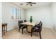 Dining room with a table, chairs, and a window with shutters at 42593 W Falling Star Ct, Maricopa, AZ 85138