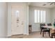 Interior entryway with a white door and dining area at 42593 W Falling Star Ct, Maricopa, AZ 85138