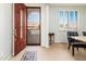 Interior entryway with a brown door and dining area at 42593 W Falling Star Ct, Maricopa, AZ 85138