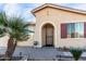 Front entrance with a security door and landscaping at 42593 W Falling Star Ct, Maricopa, AZ 85138