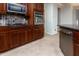 Kitchen with stainless steel appliances and dark wood cabinets at 42593 W Falling Star Ct, Maricopa, AZ 85138