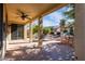 Large covered patio, built in grill, and seating area at 42593 W Falling Star Ct, Maricopa, AZ 85138