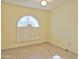 Bedroom with tile flooring and an arched window with shutters at 4302 E Rockledge Rd, Phoenix, AZ 85044