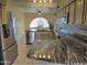 Open kitchen with granite countertops and island at 4302 E Rockledge Rd, Phoenix, AZ 85044