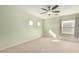 Light green bedroom with ceiling fan and window at 43864 W Elizabeth Ave, Maricopa, AZ 85138