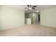 Spacious loft area with carpet and ceiling fan at 43864 W Elizabeth Ave, Maricopa, AZ 85138