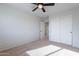 Bedroom with carpeted floor, ceiling fan, and double door closet at 4615 E Bent Tree Dr, Cave Creek, AZ 85331