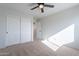 Bedroom with carpeted floor, ceiling fan, and closet at 4615 E Bent Tree Dr, Cave Creek, AZ 85331