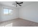 Well-lit bedroom with carpeted floor and ceiling fan at 4615 E Bent Tree Dr, Cave Creek, AZ 85331