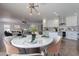 Kitchen and dining area with marble table and modern chandelier at 4615 E Bent Tree Dr, Cave Creek, AZ 85331