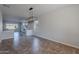 Spacious dining area with tile flooring and a large chandelier at 4615 E Bent Tree Dr, Cave Creek, AZ 85331