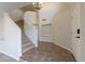 Bright and spacious entryway with a curved staircase and tile floors at 4615 E Bent Tree Dr, Cave Creek, AZ 85331