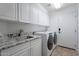 Laundry room with cabinets, sink, and washer/dryer at 4615 E Bent Tree Dr, Cave Creek, AZ 85331