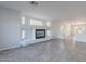 Living room featuring a fireplace with glass block accents at 4615 E Bent Tree Dr, Cave Creek, AZ 85331