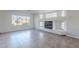 Living room with fireplace and large window overlooking backyard at 4615 E Bent Tree Dr, Cave Creek, AZ 85331