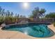 Relaxing kidney-shaped pool with a rock waterfall feature at 4615 E Bent Tree Dr, Cave Creek, AZ 85331