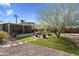 Spacious backyard with a covered patio and fire pit at 4902 W Cypress St, Phoenix, AZ 85035