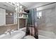 Clean bathroom with a shower/tub combo and updated fixtures at 4902 W Cypress St, Phoenix, AZ 85035