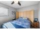 Bedroom with a bamboo headboard and blue bedding at 4902 W Cypress St, Phoenix, AZ 85035