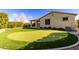 Artificial turf backyard with putting green and home view at 5720 S Wildrose --, Mesa, AZ 85212