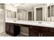 Double vanity bathroom with dark brown cabinets at 5720 S Wildrose --, Mesa, AZ 85212