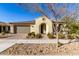 Single-story home with a two-car garage and desert landscaping at 5720 S Wildrose --, Mesa, AZ 85212