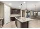 Spacious kitchen with an island, granite countertops, and stainless steel appliances at 5720 S Wildrose --, Mesa, AZ 85212