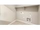 Bright laundry room with built-in shelving and tile floor at 5720 S Wildrose --, Mesa, AZ 85212