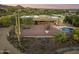 Aerial view of a home with a pool, covered patio, and desert landscaping at 5730 E Cielo N Run, Cave Creek, AZ 85331