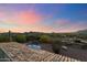 Aerial view of property showcasing pool, equestrian facilities, and scenic mountain backdrop at 5730 E Cielo N Run, Cave Creek, AZ 85331