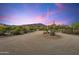 Desert landscape and mountain views at sunset along a long driveway at 5730 E Cielo N Run, Cave Creek, AZ 85331