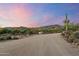 Long driveway leading to a beautiful home with desert landscape and mountain views at 5730 E Cielo N Run, Cave Creek, AZ 85331